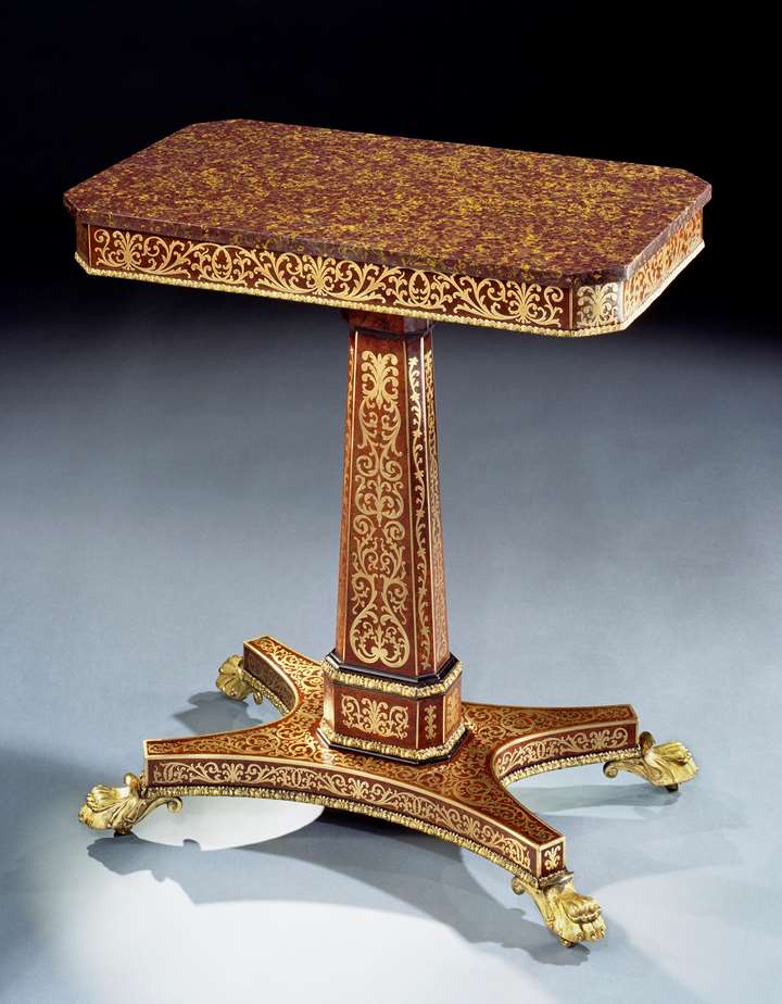 A REGENCY AMBOYNA BRASS INLAYED CENTRE TABLE